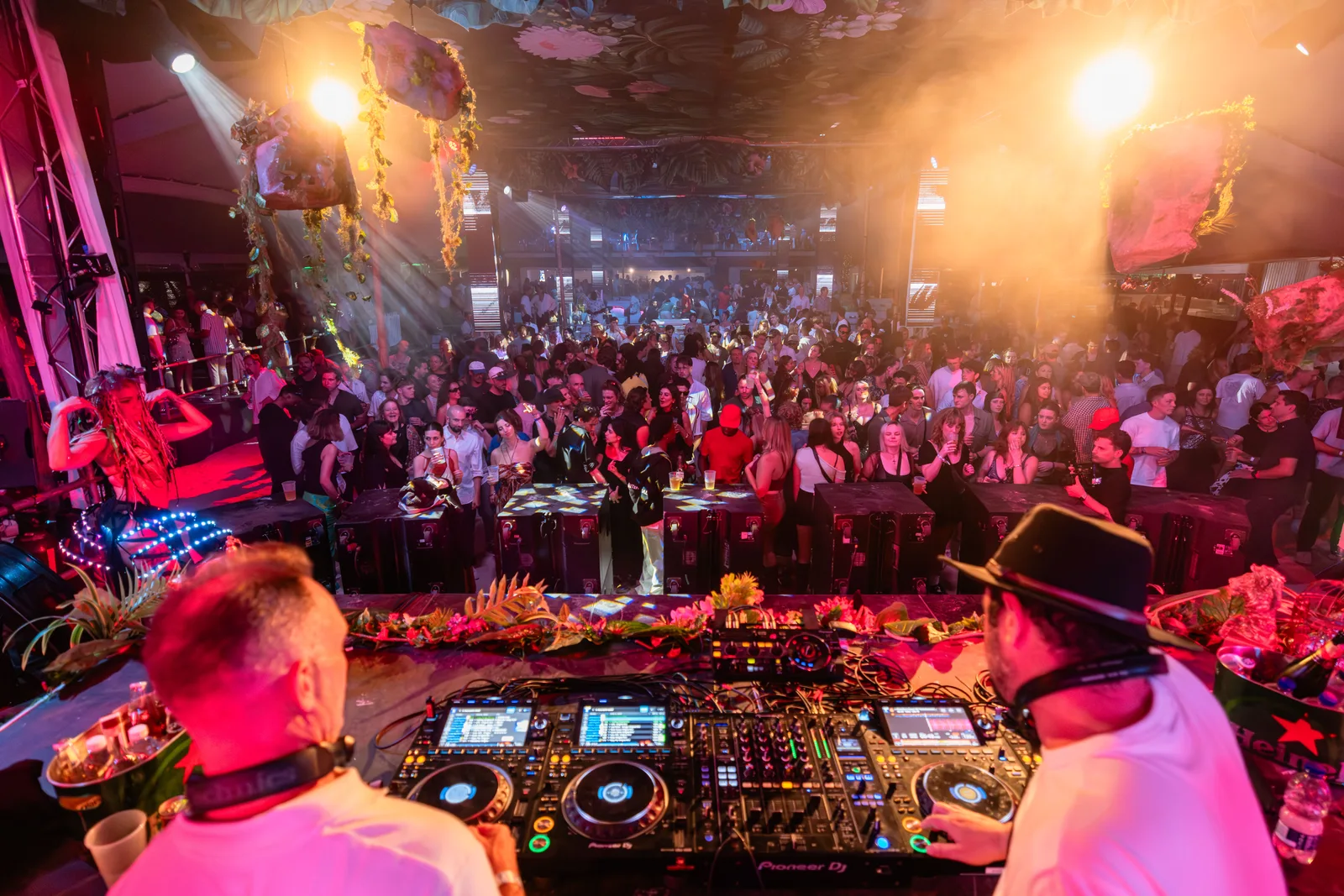 Two DJs playing to the Tropical Roast beach stage crowd