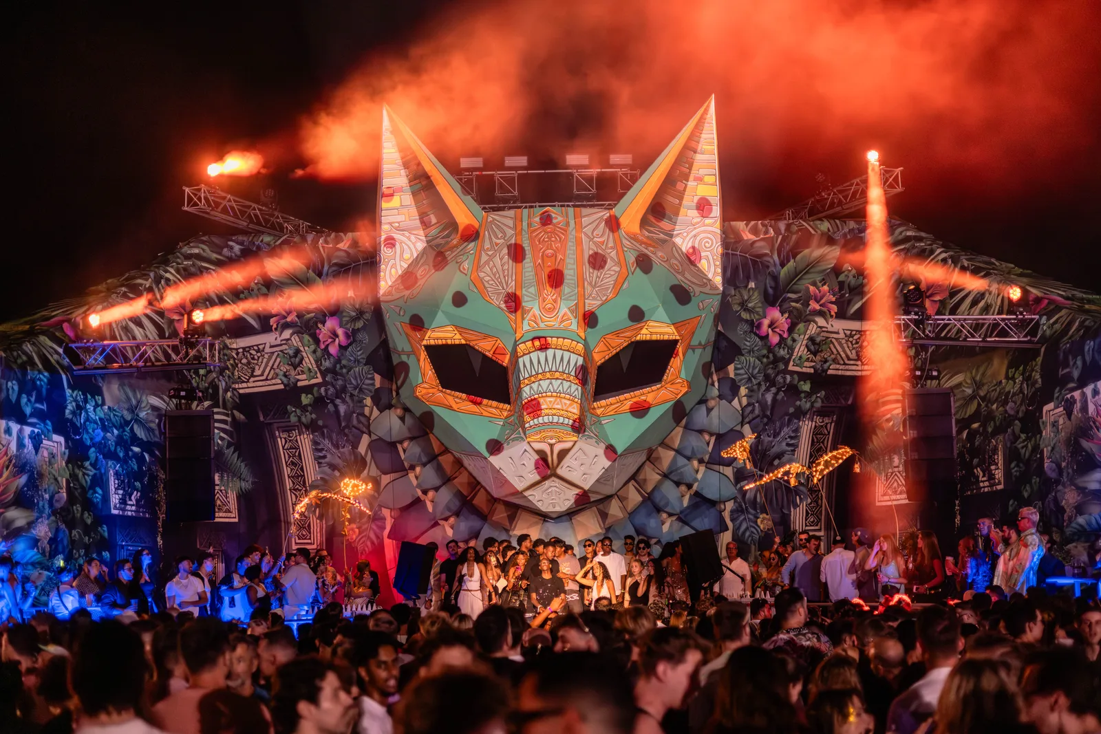 The Bazique main stage cat totem in orange light
