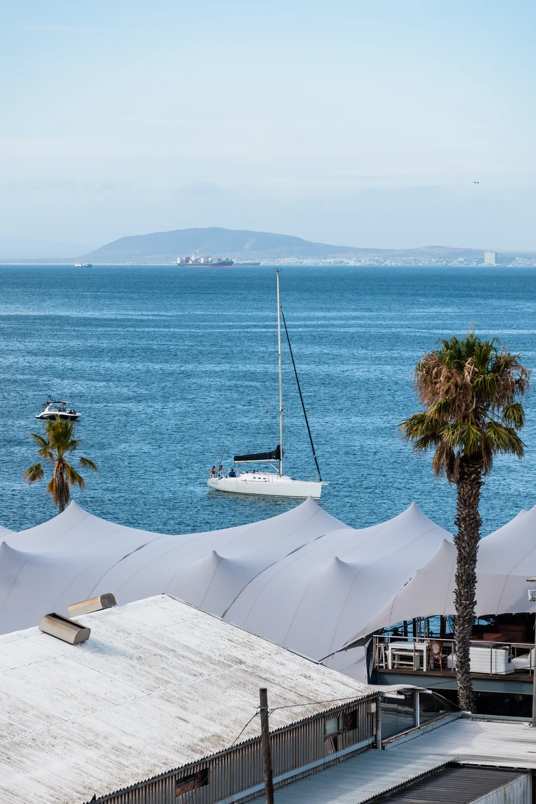 View over the Grand Africa Café & Beach tents to the Atlantic and Robben Island